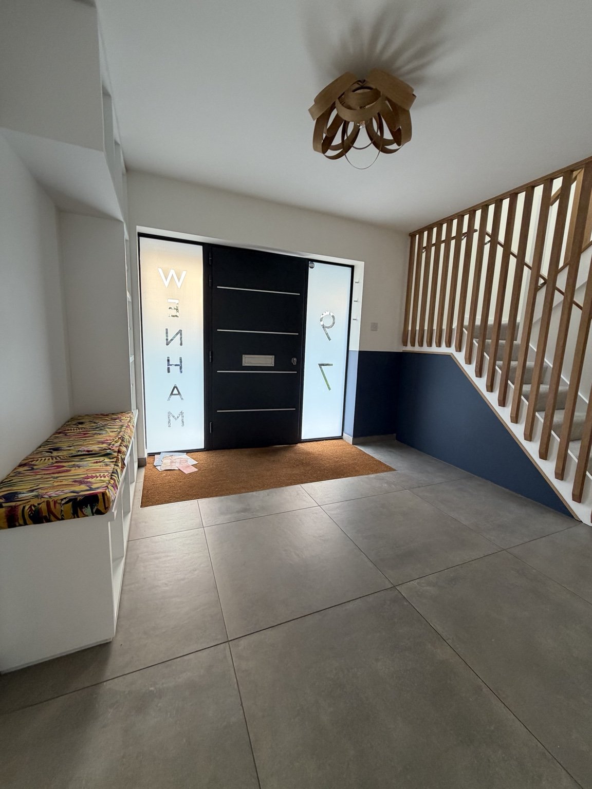 Entrance hall with carefully finished walls and woodwork
