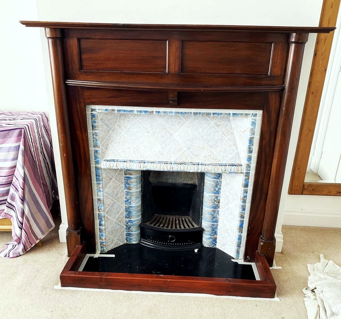 Restored timber fireplace
