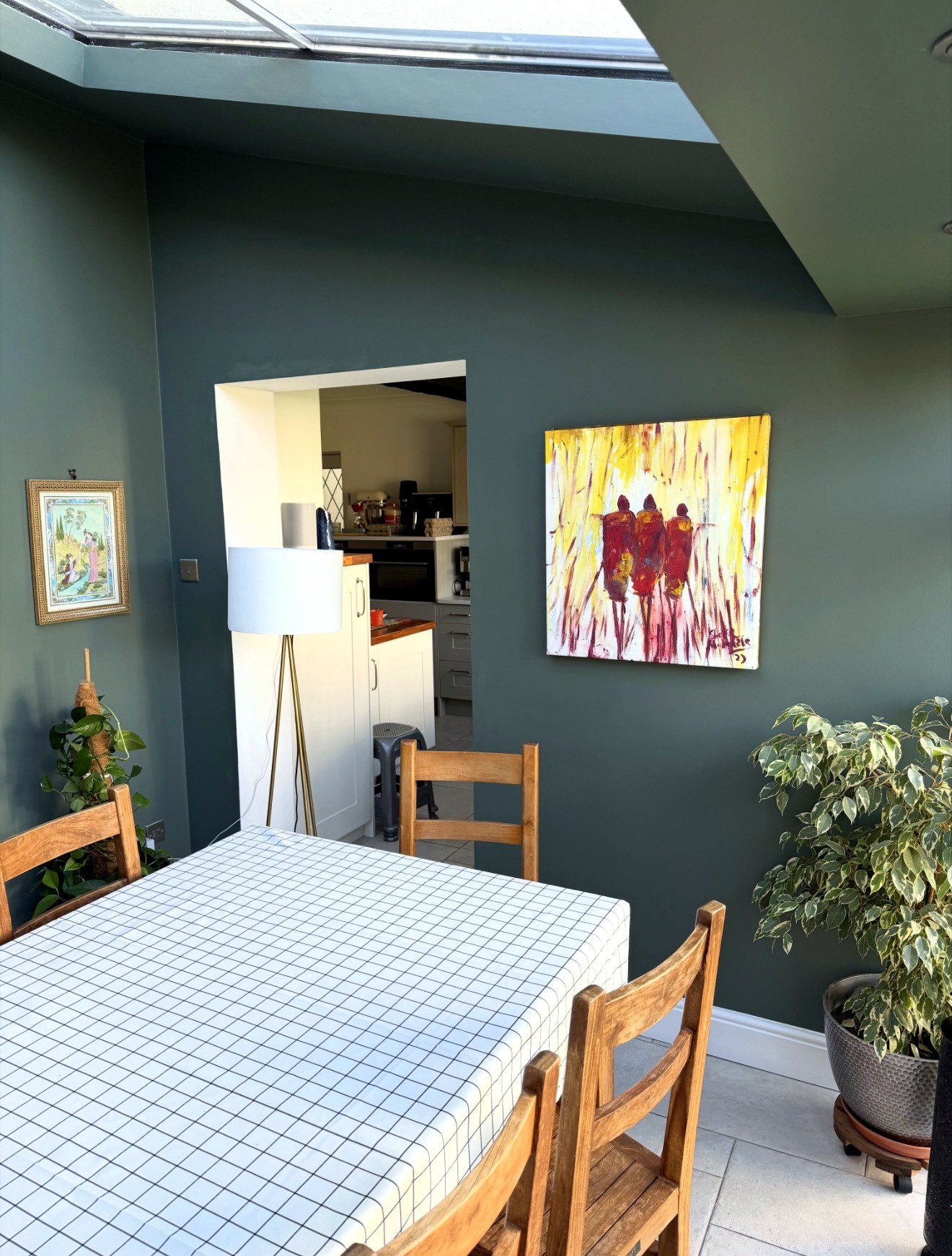Colour-rich green dining room after decorating