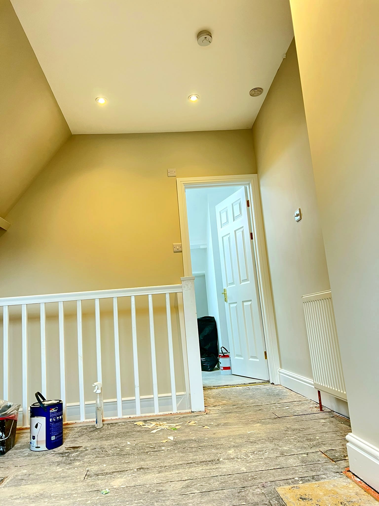 Finished landing with clean white balustrade