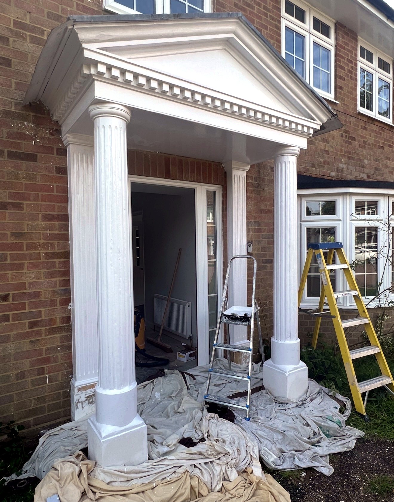 Period entrance portico during restoration
