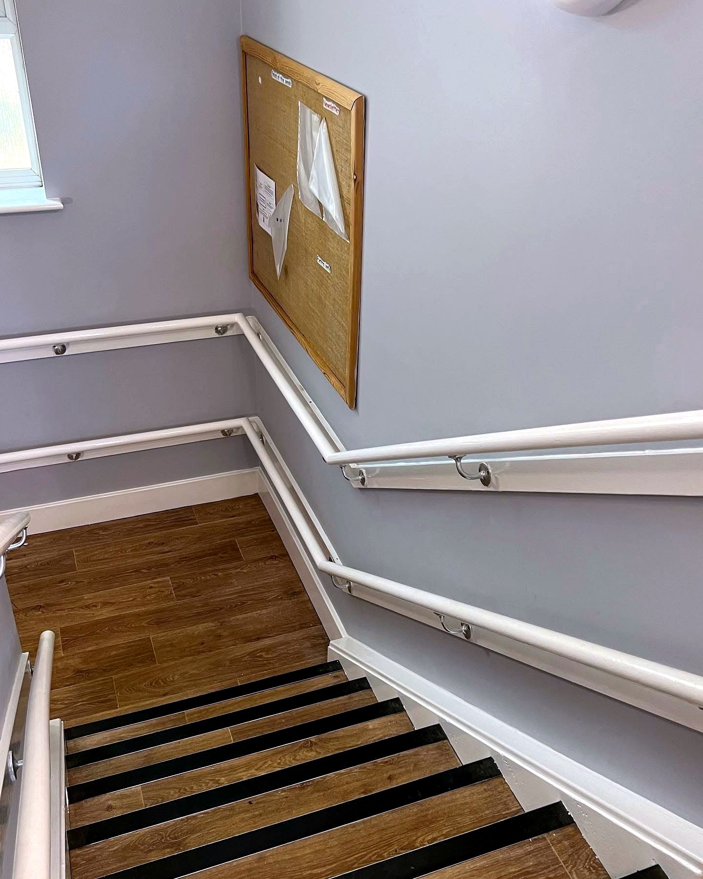 Finished staircase handrail and walls